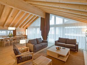 a living room with two couches and a table at Apartment Zur Matte B-9 by Interhome in Zermatt