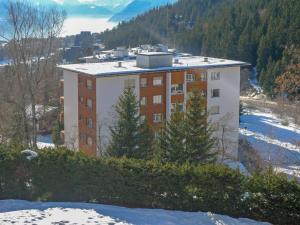 a building on the side of a mountain in the snow at Apartment Vermala-Soleil A-B-4 by Interhome in Vermala