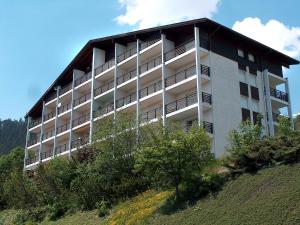 a large building on top of a hill at Apartment Armorial Est 72 by Interhome in Vermala