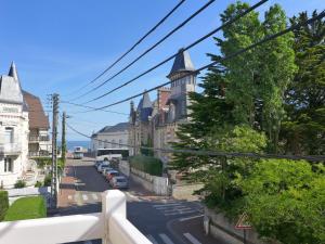 a view of a city street with buildings at Apartment Le Manoir du Casino by Interhome in Cabourg