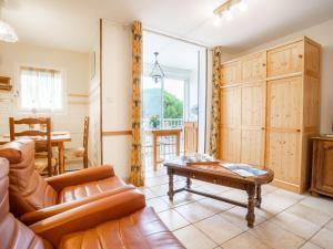 a living room with a couch and a table at Studio Les Sables d'Or-10 by Interhome in Le Grau-du-Roi