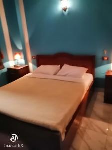 Postel nebo postele na pokoji v ubytování Al Hambra Hotel