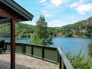 a view of a lake from a house at Holiday Home Neset - SOW043 by Interhome in Lyngdal