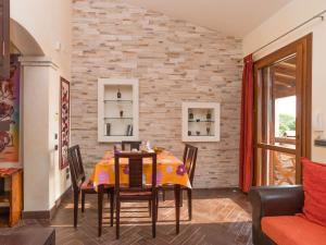 a dining room with a table and chairs at Apartment Appartamento Doria - REI186 by Interhome in Monte Nai