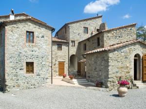 a large stone building with two entrances to it at Apartment Borgo Cerbaiola-1 by Interhome in Casa Montacuto