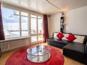 a living room with a couch and a glass table at Apartment Neige d'or - Val Claret-2 by Interhome in Tignes