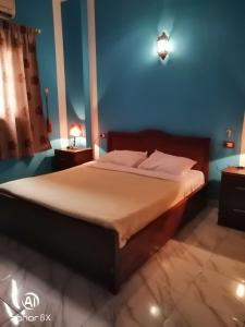 Postel nebo postele na pokoji v ubytování Al Hambra Hotel