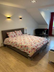 Postel nebo postele na pokoji v ubytování B&B groot-bijgaarden center