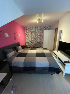 TV a/nebo společenská místnost v ubytování B&B groot-bijgaarden center