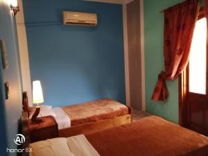 Postel nebo postele na pokoji v ubytování Al Hambra Hotel