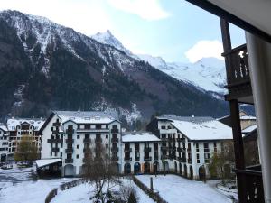 a view of a resort in the mountains with snow at Apartment La Forclaz-2 by Interhome in Chamonix