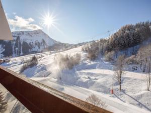 a view of a ski slope in the snow at Apartment Vostok Zodiaque-70 by Interhome in Le Corbier