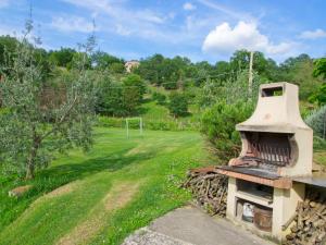 an old stove sitting on top of a field at Holiday Home Sunflower by Interhome in Acqualoreto