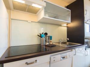 a kitchen with a sink and a counter top at Apartment Porto di Mar-5 by Interhome in Cavalaire-sur-Mer