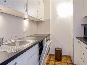 A kitchen or kitchenette at Apartment Arzinol 402 by Interhome