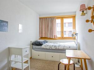 A bed or beds in a room at Apartment Arzinol 402 by Interhome