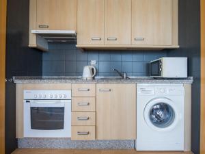 a kitchen with a washing machine and a washer at Apartment Punta Cormoran by Interhome in La Manga del Mar Menor