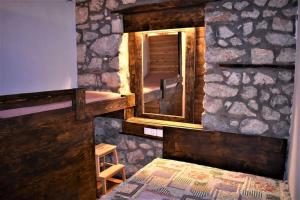 Fotografie z fotogalerie ubytování Μικρή Πέτρινη Μεζονέτα 2 v destinaci Lílaia