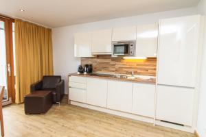 Kuchyň nebo kuchyňský kout v ubytování Emma Apartments-