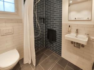 a bathroom with a toilet and a sink at Apartment Haus Altein Apartment Nr- 4 by Interhome in Davos