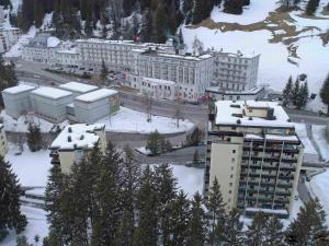 a city with buildings in the snow with trees at Apartment Allod Park Haus C 305 by Interhome in Davos