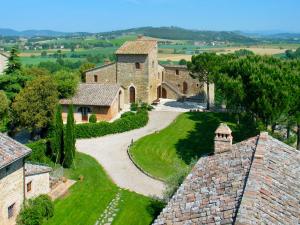 an aerial view of a large stone building with a driveway at Villa Borgo Monticelli-2 by Interhome in Castiglione della Valle