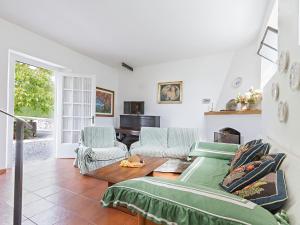 a living room with a couch and a table at Holiday Home Gli Antichi by Interhome in Camaiore