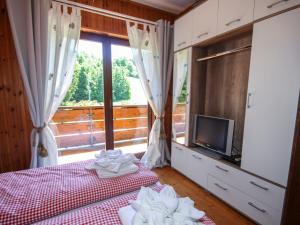 Postel nebo postele na pokoji v ubytování Holiday Home Rustika by Interhome