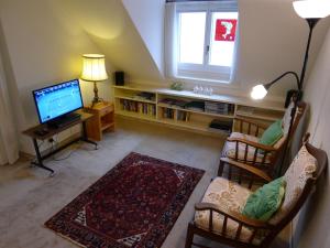 Μια τηλεόραση ή/και κέντρο ψυχαγωγίας στο Apartment Seeblick by Interhome