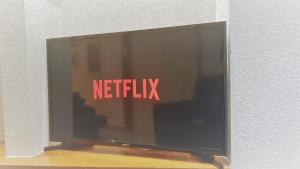 A television and/or entertainment centre at Apartments Plaza Mayor