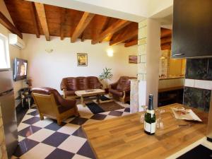 a living room with leather chairs and a table at Holiday Home Villa Ana by Interhome in Kruševo
