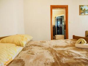 a bedroom with a large bed and a mirror at Holiday Home Villa Ana by Interhome in Kruševo +26 photos