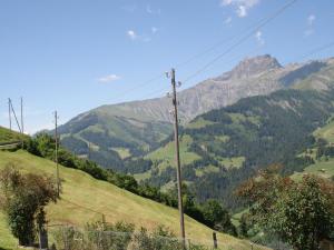a view of the mountains from the road at Apartment Bauernhaus Uf dr Flue by Interhome in Achseten
