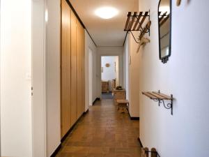 a hallway leading to a room with a hallway at Apartment Chesa Islas by Interhome in Pontresina