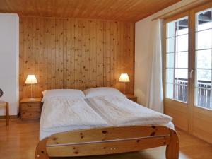 Postel nebo postele na pokoji v ubytování Chalet Chalet Bühlweidli by Interhome