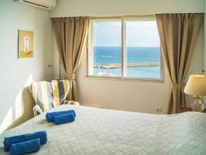 a bedroom with a bed with a view of the ocean at Apartment Puerto Paraíso by Interhome in Estepona