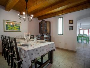 a large dining room with a table and chairs at Holiday Home Ivanka by Interhome in Čabrunići