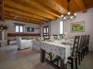 a large dining room with a table and chairs at Holiday Home Ivanka by Interhome in Čabrunići