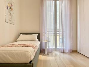 A bed or beds in a room at CasaViva-Lovely Bilo in Santa with AC