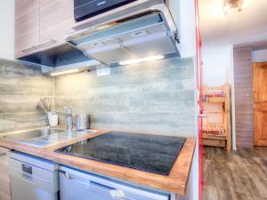 a kitchen with a sink and a counter top at Studio Plein Soleil - Val Claret-9 by Interhome in Tignes