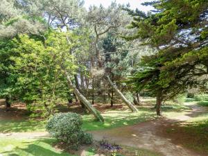 a park with trees and a path in the grass at Apartment Port An Dro-1 by Interhome in Carnac