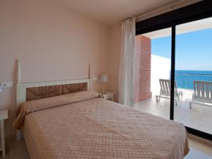 A bed or beds in a room at Apartment in Torrox Coast- front seaview by Interhome