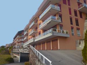 a building with balconies on the side of it at Apartment Montreux - Panorama by Interhome in Montreux