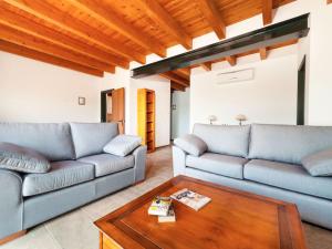 a living room with two couches and a coffee table at Holiday Home Toscana by Interhome in Lloret de Mar