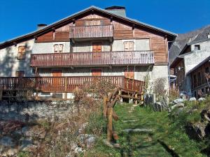 a large wooden house with a deck on the side of it at Apartment Chalet Le Tour by Interhome in Chamonix