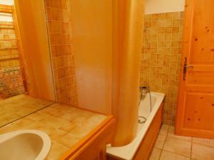 a bathroom with a sink and a toilet and a tub at Apartment Chalet Le Tour by Interhome in Chamonix +14 photos