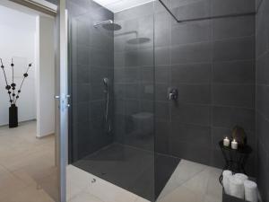 a shower with a glass door in a bathroom at Apartment Villa Fasana by Interhome in Fažana +15 photos