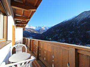 a balcony with a toilet and a view of mountains at Apartment Berneckblick by Interhome in Kauns