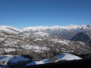 an aerial view of a snow covered mountain range at Studio Pegase Phenix-59 by Interhome in Le Corbier