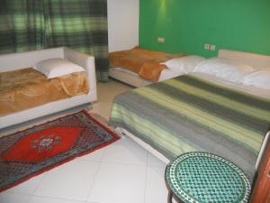 Postel nebo postele na pokoji v ubytování Riad Passiflora